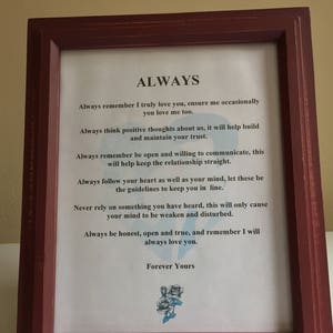 May include: A framed print with a white background and black text that reads "ALWAYS" and includes a list of advice. The text is framed in a dark red wood frame.