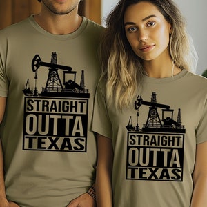 May include: Two people wearing olive green t-shirts with a black oil rig graphic and the text "Straight Outta Texas".