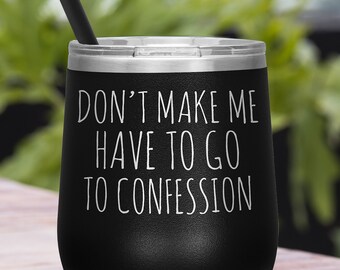 May include: Black stainless steel wine tumbler with a white inscription that reads "Don't make me have to go to confession".