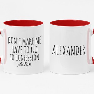 May include: Two white ceramic mugs with red interiors and handles. One mug has the text "DON'T MAKE ME HAVE TO GO TO CONFESSION" and a small leaf design. The other mug has the name "ALEXANDER" in black text.