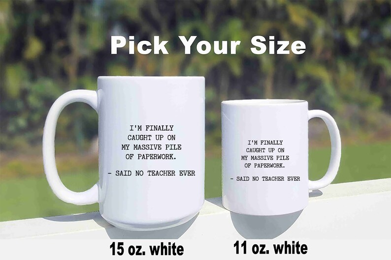 May include: Two white ceramic mugs with a funny saying about teachers and paperwork. The mug on the left is 15 ounces and the mug on the right is 11 ounces.