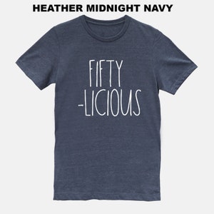 May include: A heather midnight navy t-shirt with the text "FIFTY -LICIOUS" in white.