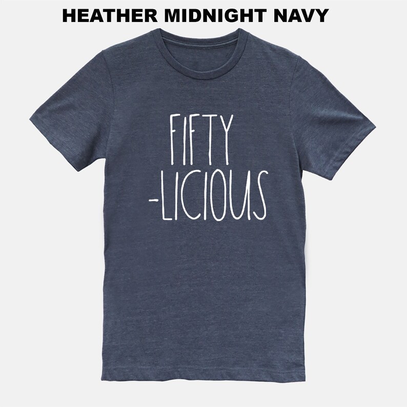 May include: A heather midnight navy t-shirt with the text "FIFTY -LICIOUS" in white.