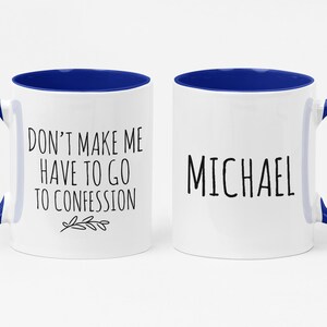 May include: Two white ceramic mugs with blue interiors and handles. One mug has the text "DON'T MAKE ME HAVE TO GO TO CONFESSION" and the other says "MICHAEL" in black lettering. A fun gift idea.