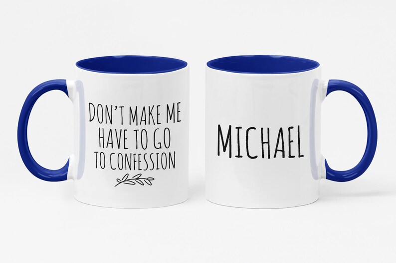 May include: Two white ceramic mugs with blue interiors and handles. One mug has the text "DON'T MAKE ME HAVE TO GO TO CONFESSION" and the other says "MICHAEL" in black lettering. A fun gift idea.