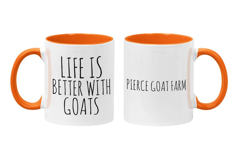 May include: A white ceramic mug with an orange rim and handle. The mug has the text "Life is better with goats" on one side and "Pierce Goat Farm" on the other side.