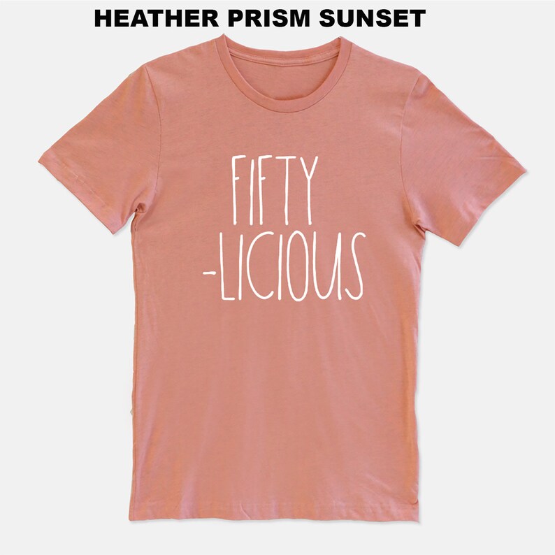 May include: A heather prism sunset colored t-shirt with the text "FIFTY -LICIOUS" in white.