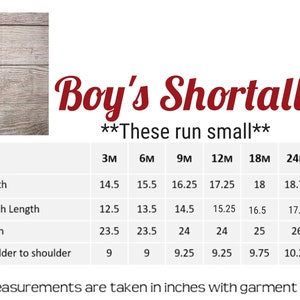May include: A green and white striped shortall with a sailboat design. The size chart shows measurements in inches for sizes 3 months to 3T. The text "Boy's Shortall" and "These run small" is also included.