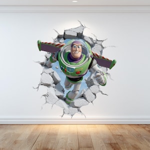May include: A wall sticker showing Buzz Lightyear bursting through a wall. The character is in his green, white, and purple spacesuit, with wings out. The wall is cracked and broken, creating a 3D effect, with the character emerging.