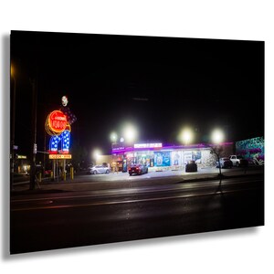 Circus Liquor Neon Sign At Night In North Hollywood California With Vintage Storefront And Blurred Lights From Black Mist Filter