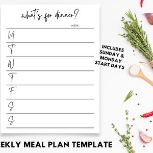 May include: A white weekly meal plan template with the text "what's for dinner?" and lines for each day of the week. The template includes Sunday and Monday start days. Fresh herbs, spices, and a wooden spoon are arranged around the template.