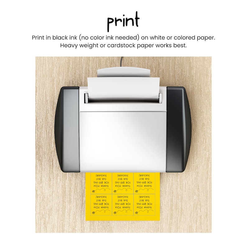 May include: A white and black printer printing yellow labels with the text "THANK YOU FOR BEE-ING THE BEST TEACHER" in black ink. The word "print" is at the top of the image.