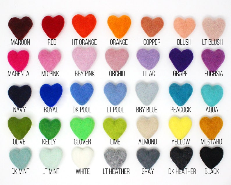 May include: A color chart featuring heart-shaped felt pieces in a variety of colors. The chart includes shades like maroon, red, orange, pink, purple, blue, green, yellow, and black, each labeled with its name. The felt hearts are arranged in rows and columns.