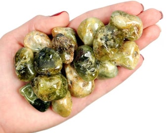 May include: A collection of green and yellow tumbled stones. The stones are smooth and polished, and they have a variety of shapes and sizes.