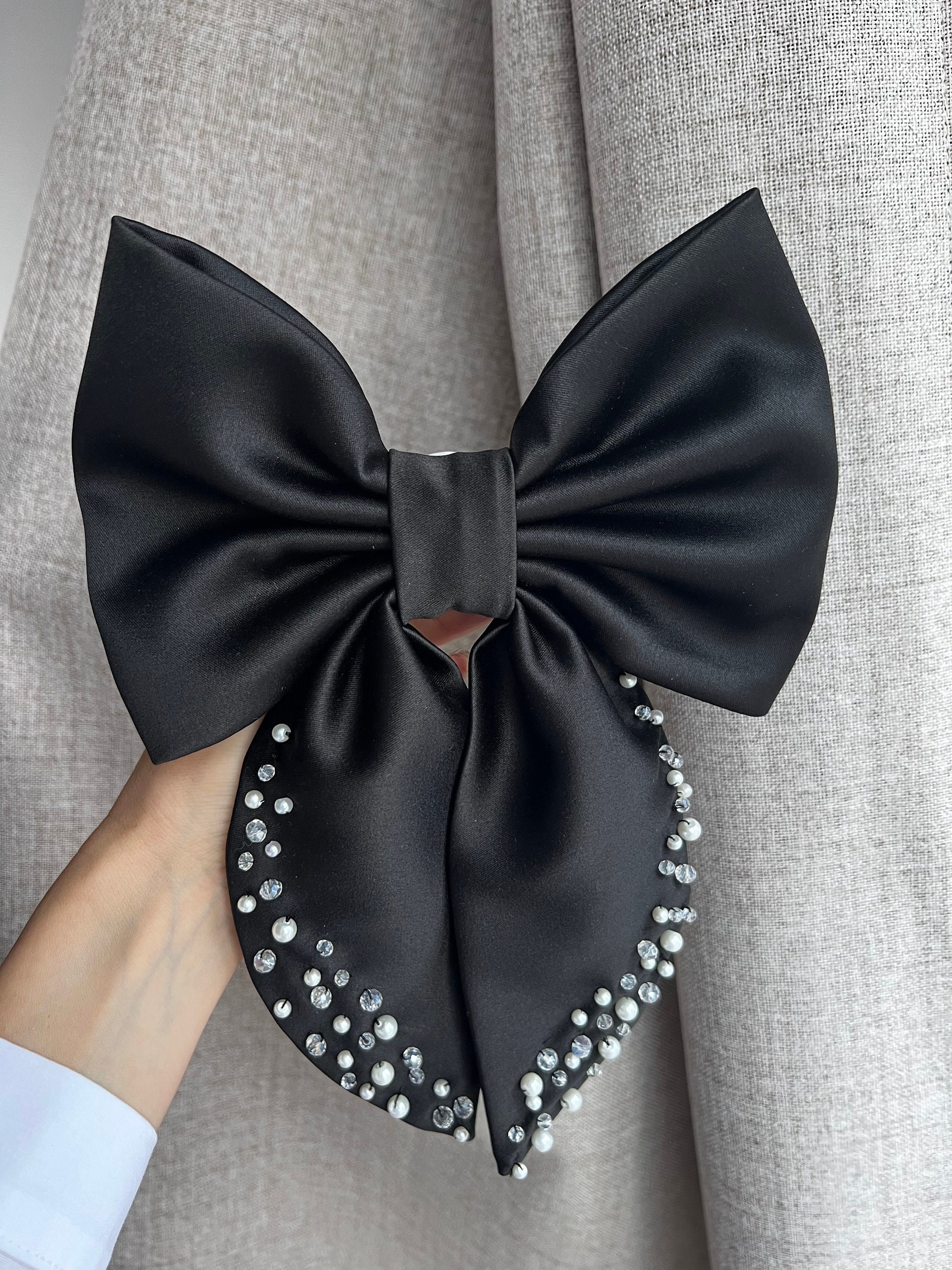Revolve Lovers and Friends‎ Black Satin Bow Crystals Hair Barette 21 Best Hair Bows to Turn Up the Charm On Any Look 2024 | Allure main image 2