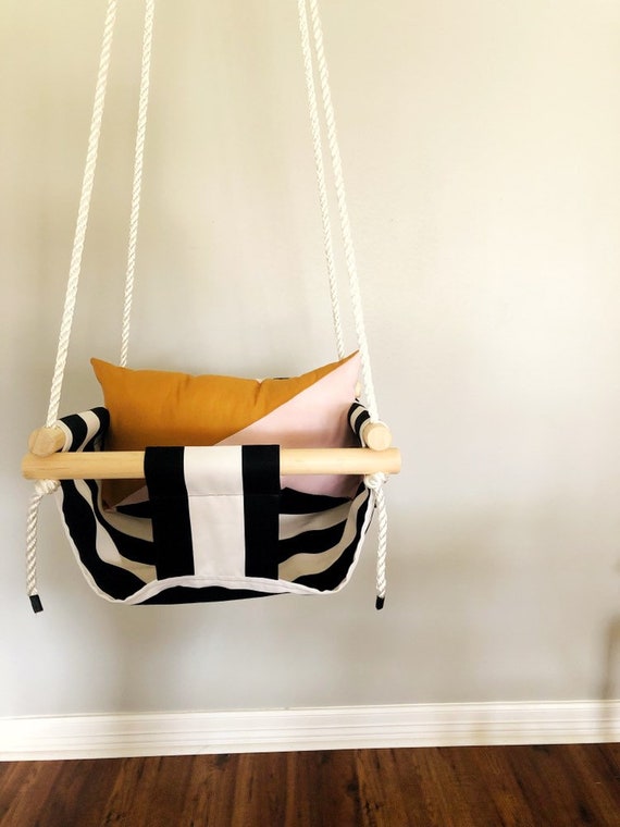 pink and black baby swing