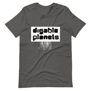 May include: A dark gray t-shirt with a white rectangle featuring the text "digable planets" in black letters with various symbols incorporated into the letters. The rectangle has white roots extending from the bottom.