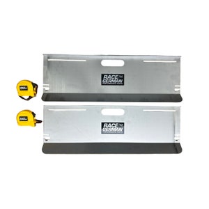 May include: Two silver metal panels with the text "RACE GERMAN PERFORMANCE PARTS" printed on them. Two yellow measuring tapes are included.