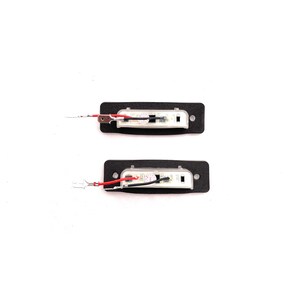 May include: Two black rectangular LED light fixtures with clear lenses and red and black wires attached. The lights are on a white background.