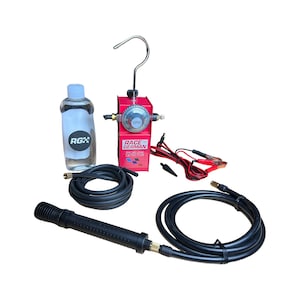 May include: Red smoke leak detector with a gauge, a black hose, a black nozzle, a bottle of clear fluid, and a pair of red jumper cables. The device is labeled "Race 100% German Smoke Leak Detector".