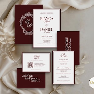 May include: A set of burgundy and white wedding stationery, including invitations, RSVP cards, and detail cards. The invitations display the names "Bianca Taylor & Daniel Carter" and the date "28 August 200XX".
