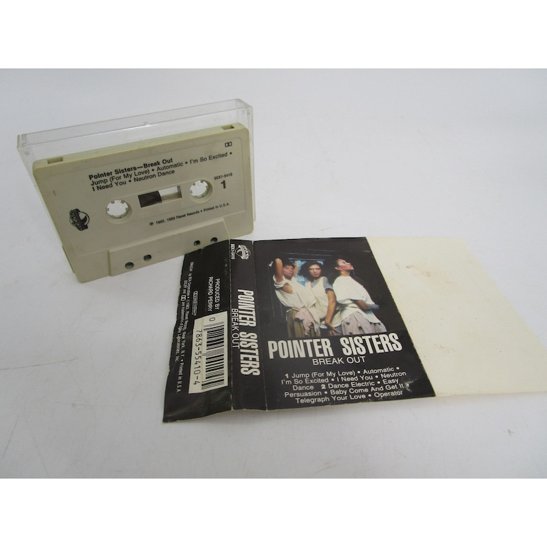 May include: A cassette tape case with a black and white photo of the Pointer Sisters on the front. The case is labeled "Pointer Sisters - Break Out" and lists the songs on the tape: "Jump (For My Love), Automatic, I'm So Excited, I Need You, Neutron Dance, Dance 2 Dance Electric, Easy Persuasion, Baby Come And Get It, Telegraph Your Love, Operator."