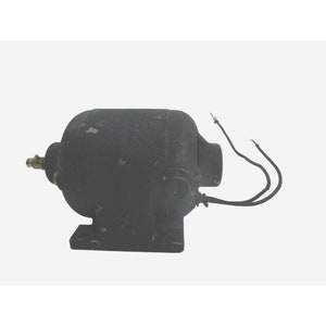 May include: A black electric motor with a wire cord and two wires. The motor has a round body and a rectangular base.