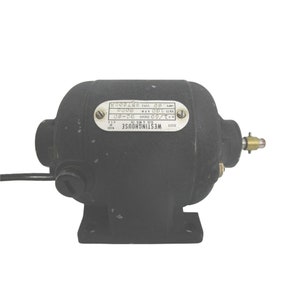 May include: A black Westinghouse electric motor with a metal nameplate that reads "Westinghouse Elec & Mfs Co. Made U.S.A. P1/60 Cycles DC-60 Volts 100 RPM. 8000 Amps 60 Style 576008".