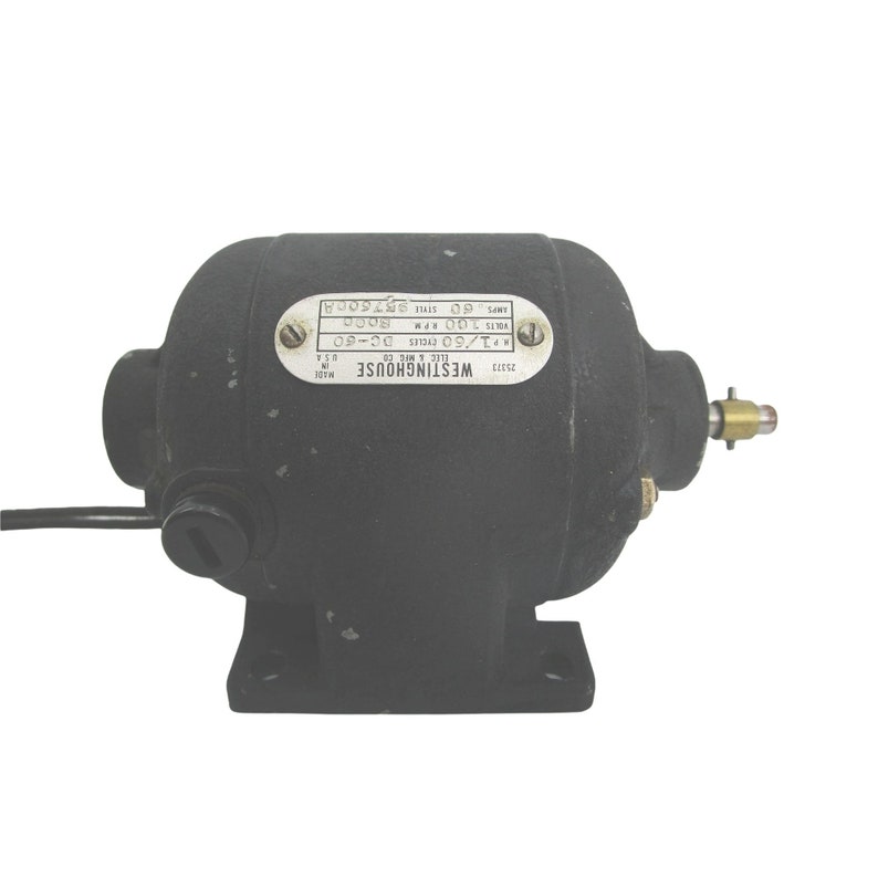 May include: A black Westinghouse electric motor with a metal nameplate that reads "Westinghouse Elec & Mfs Co. Made U.S.A. P1/60 Cycles DC-60 Volts 100 RPM. 8000 Amps 60 Style 576008".