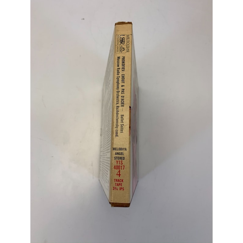 May include: A brown and white cassette tape case with the title "PROKOFIEV: CHOUT & PAS D'ACIER - Ballet Suites" and the text "Moscow Radio Symphony Orchestra, Rozhdestvensky cond." printed on the side. The case also includes the text "MELODIYA ANGEL STEREO Y1S 40017 4 TRACK TAPE 3 3/4 IPS".