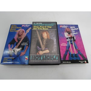Pode incluir: Três fitas VHS com aulas de baixo. As fitas são intituladas "Billy Sheehan Bass Secrets", "Stuart Hamm Slap, Pop & Tap For The Bass" e "Billy Sheehan On Bass". Cada fita apresenta um baixista diferente e inclui uma foto do baixista na capa.