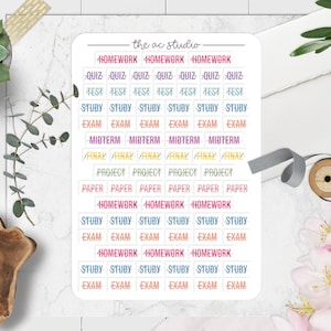 May include: A sheet of colorful stickers with the words "homework", "quiz", "test", "study", "exam", "midterm", "final", "project", "paper", and "the ac studio" printed on them.
