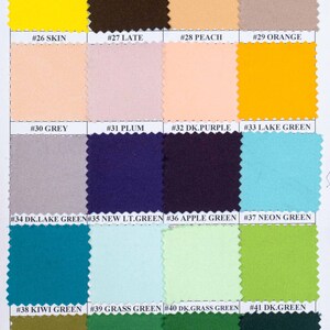 May include: A color swatch chart featuring various fabric samples. The chart displays a range of colors, including yellow, brown, gold, peach, orange, grey, plum, purple, and green. Each swatch is labeled with a number and color name.