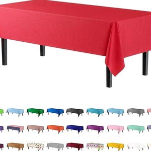 May include: A red rectangular tablecloth draped over a black table. Below, a variety of tablecloths in different colors are displayed, including green, blue, black, and pink. The tablecloths are suitable for various events.