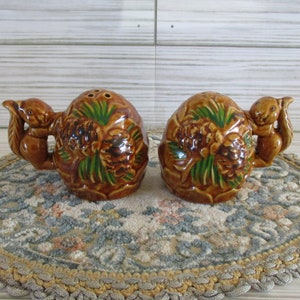 Vintage squirrel salt and pepper shakers, squirrels with pinecones, no stoppers
