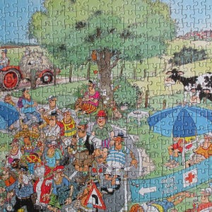 May include: A colorful jigsaw puzzle featuring a busy outdoor scene with a red tractor, black and white cows, and a crowd of people. A blue banner in the foreground displays the text 'REST AND HELP' with a red cross symbol and a directional arrow.