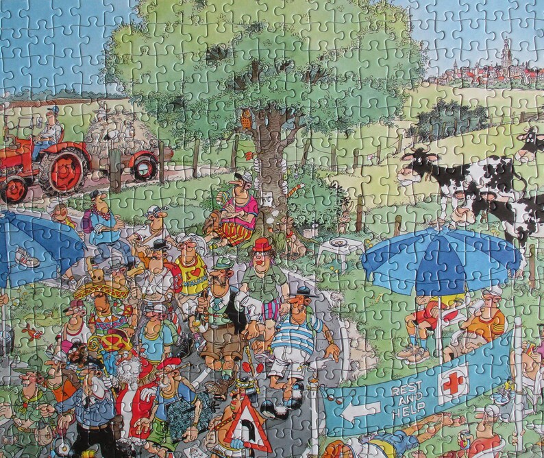 May include: A colorful jigsaw puzzle featuring a busy outdoor scene with a red tractor, black and white cows, and a crowd of people. A blue banner in the foreground displays the text 'REST AND HELP' with a red cross symbol and a directional arrow.