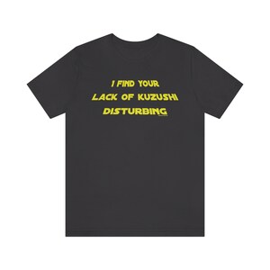 May include: A dark gray t-shirt with yellow text that reads "I find your lack of Kuzushi disturbing."