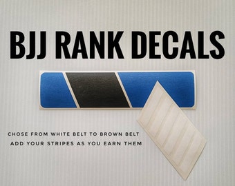 May include: BJJ Rank Decals: A set of blue, black, and white decals for marking BJJ belt ranks. The decals are designed to be added to a belt as a person progresses through the ranks. The text on the image reads "BJJ Rank Decals, Choose from white belt to brown belt, Add your stripes as you earn them."