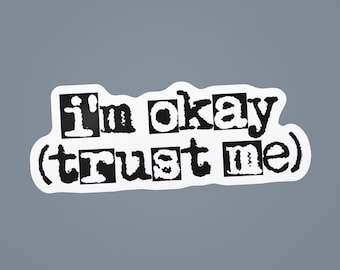 May include: White sticker with black text that reads "I'm okay (trust me)".