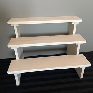 Step display shelf clearance