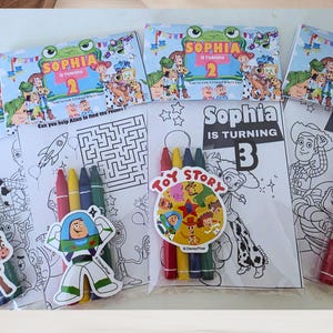 May include: Toy Story themed activity packs featuring coloring sheets with characters like Woody and Buzz Lightyear, maze puzzles, and sets of four crayons. Each pack includes a personalized header card with the text Sophia is turning 2 or 3.