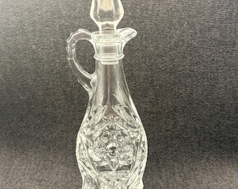 Ampolla vintage in vetro pressato trasparente con manico e tappo arrotondato abbinato, con decorazione a Stella di David.