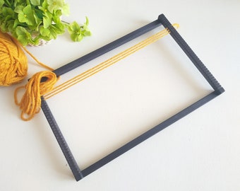 Black wooden weaving loom, small tapestry frame, lap loom