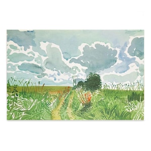 May include: Watercolor painting of a field with tall green grass and a dirt path leading towards a tree and a utility pole. The sky is filled with blue and gray clouds. Reddish-orange plants are visible.