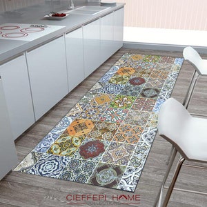 May include: A colorful patterned kitchen runner rug with a geometric design. The rug is made of a durable material and is perfect for adding a touch of style to any kitchen.