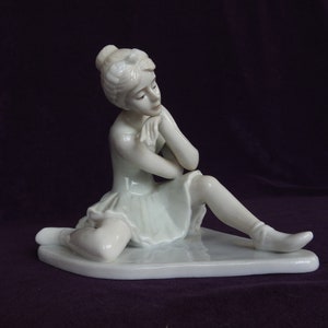 Seated girl Ballerina- porcelain figurine