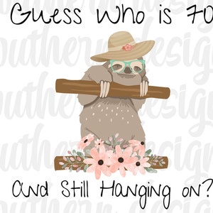 May include: A sloth wearing a straw hat and glasses with pink flowers around it. The text says "Guess who is 70 and still hanging on?"