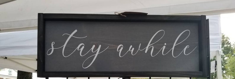 Stay Awhile wooden framed sign