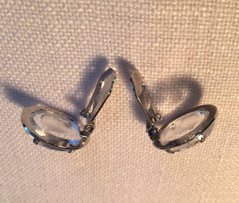 Vintage silvertone Joseph Warner intaglio crystal clip earrings